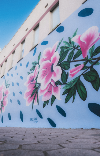 This vibrant mural bursts with beautiful flowers, perfectly capturing the spirit of Valdosta, famously known as the "Azalea City."